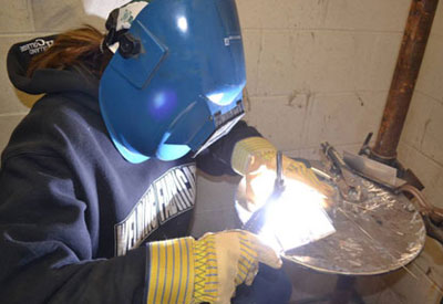 Woman welding